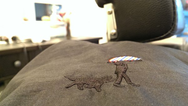 Mr. Hobbs embroidered onto the barber capes